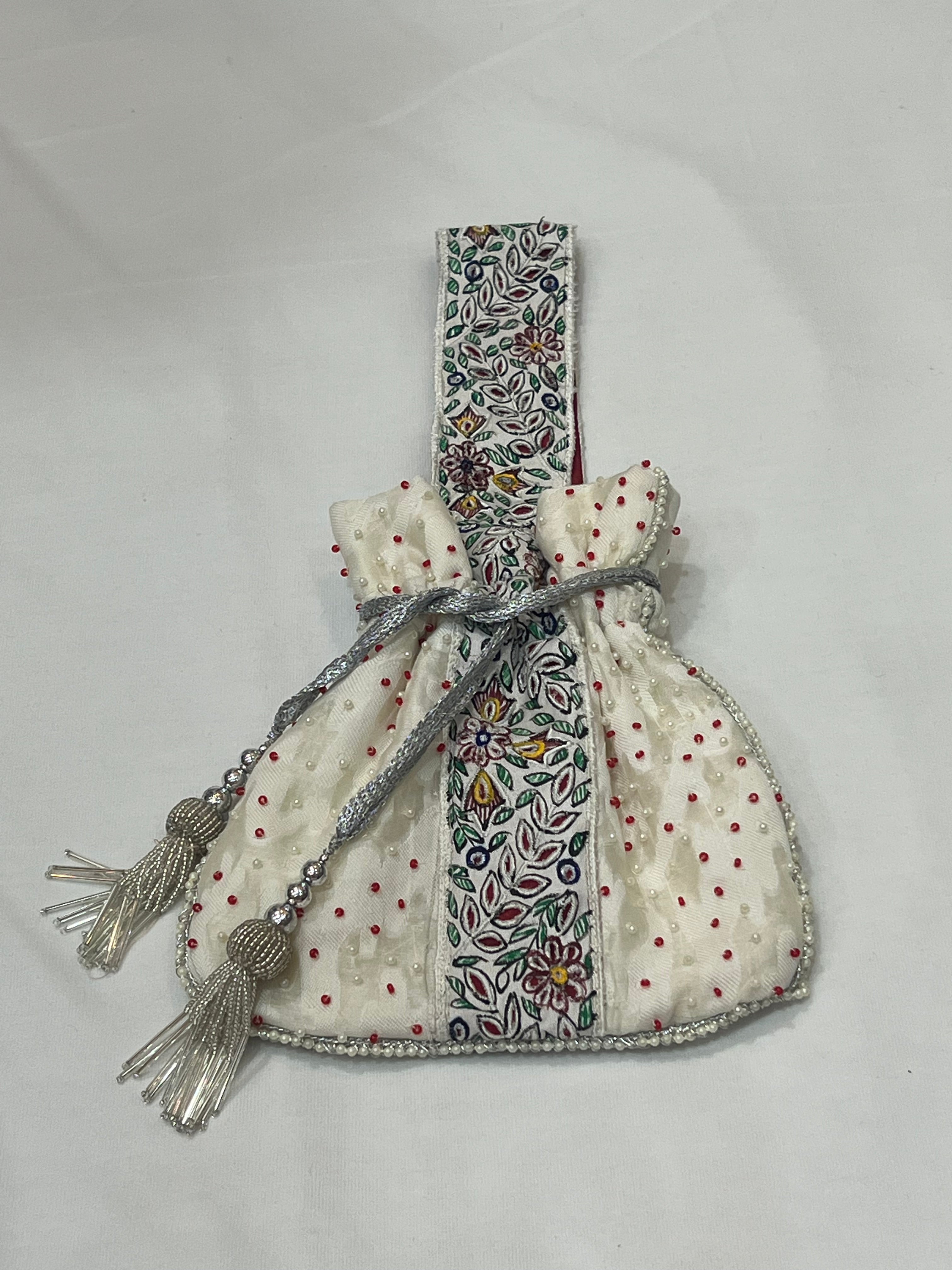 Hand-Painted White Potli with Pearl and Red Bead Accents